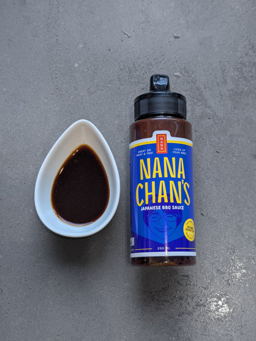 Nana Chan's Japanese BBQ sauce bottle with a small bowl of sauce on a gray surface